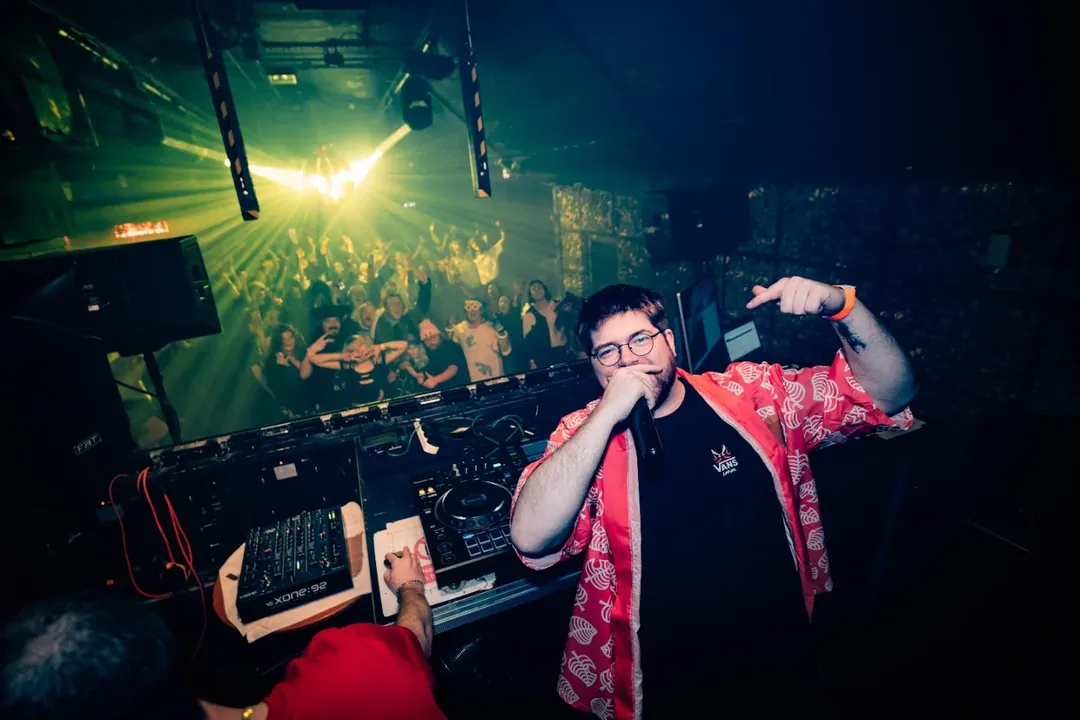 NerdyNI host facing a packed anime disco crowd