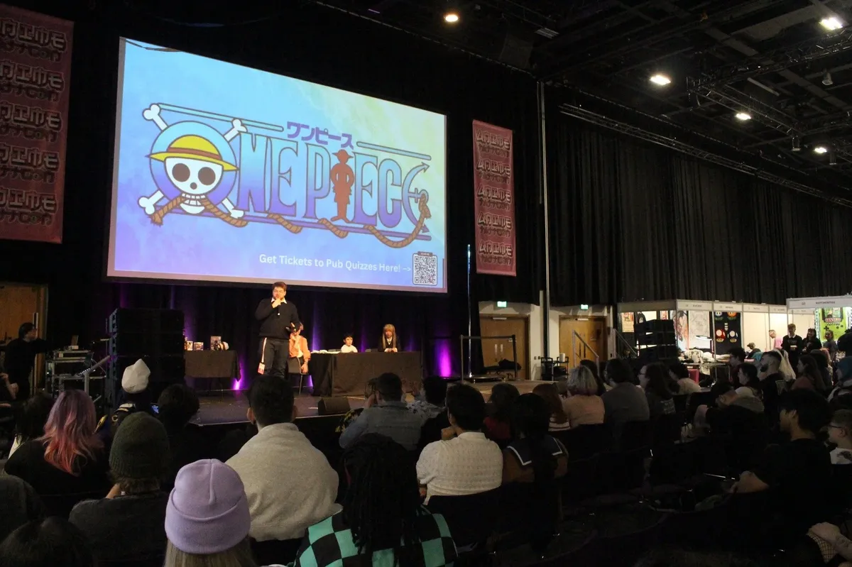 A packed audience watching Callum on stage