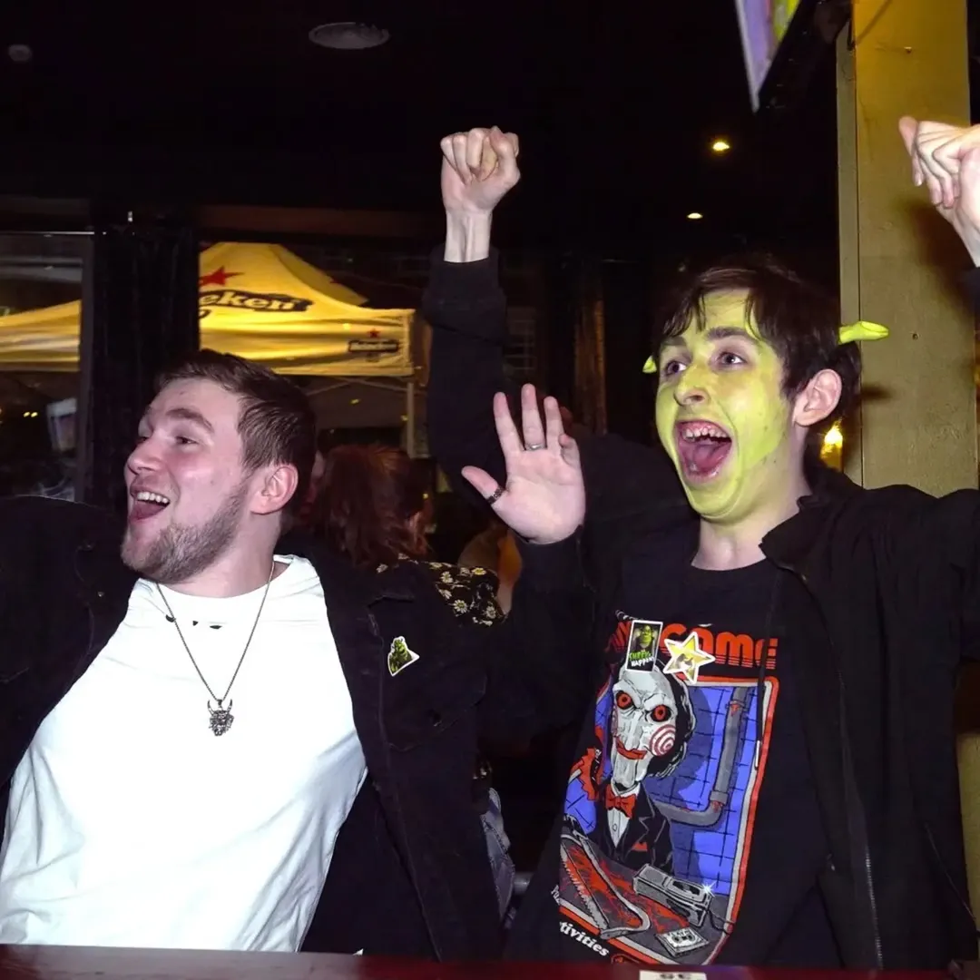 Two attendees cheering